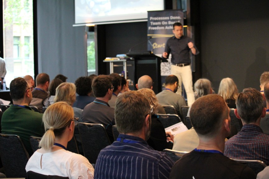 David Jenyns on stage at the Business Systems & AI Summit